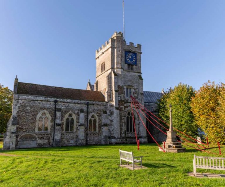 Historic church with a clock tower and well-kept grounds in Fordingbridge.