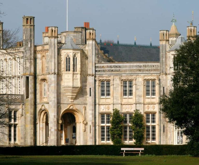 The grand facade of Highcliffe Castle, showcasing Gothic Revival architecture.